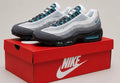 Nike Air Max 95 in a white/grey colourway with turquoise (blue) accents.