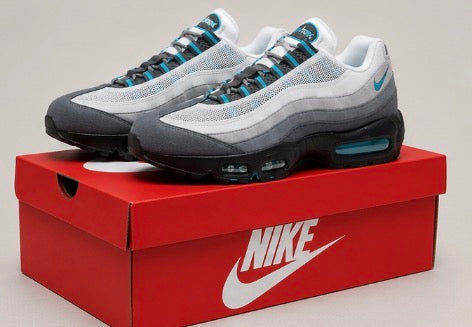 Nike Air Max 95 in a white/grey colourway with turquoise (blue) accents.